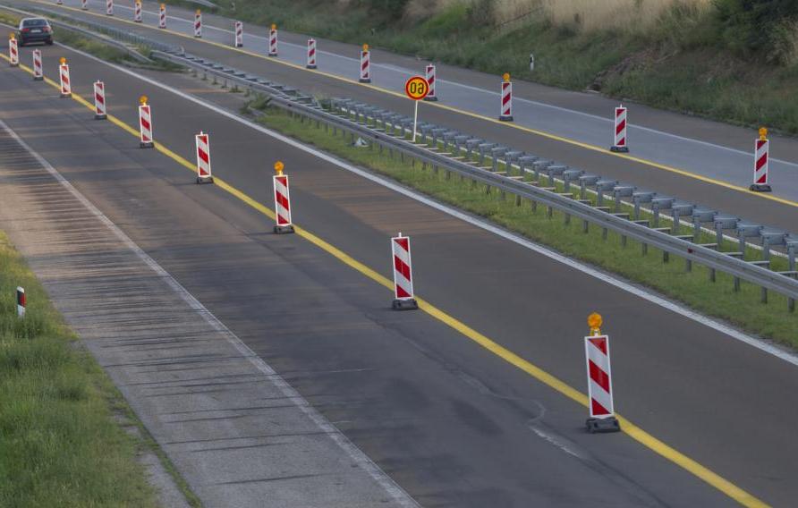 Road barriers marking closed highway lane due to road works