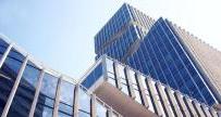 Stock image of skyscrapers with glass windows top to bottom