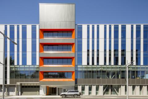 External view of the main entrance to the new hospital building on a sunny day